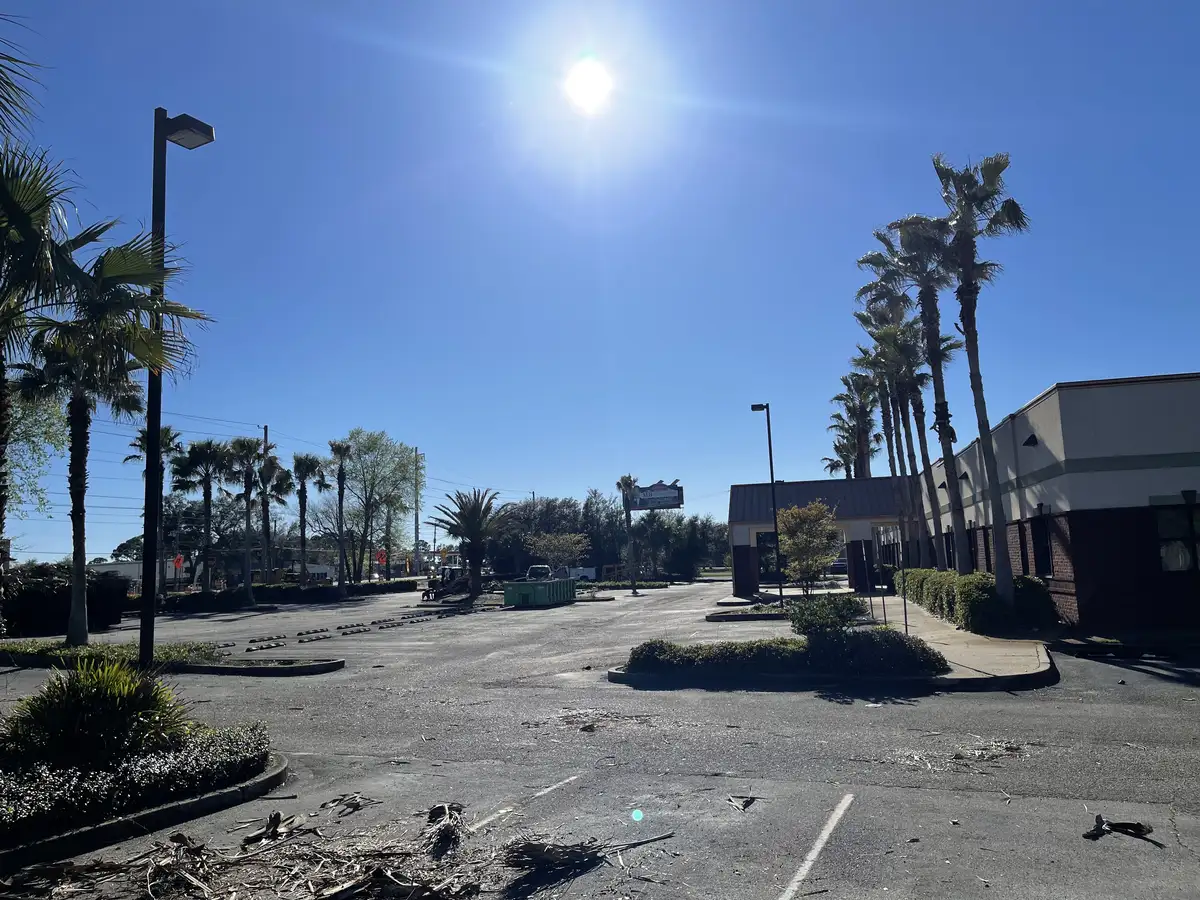 Commercial lawn care equipment and crew on job site