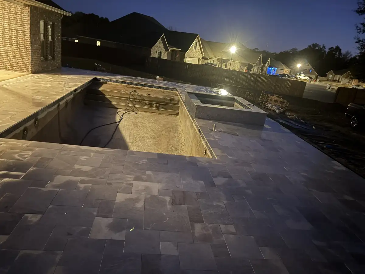 Completed paver patio project with landscape surround