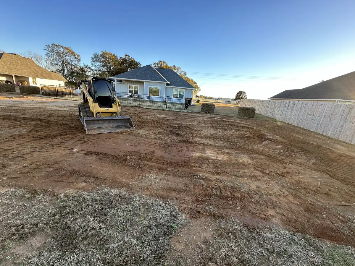 Sod being laid on prepared soil